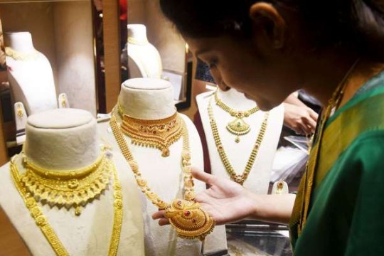 Gold prices touch new highs on weak dollar, fiscal worries, central banks buying: Report
