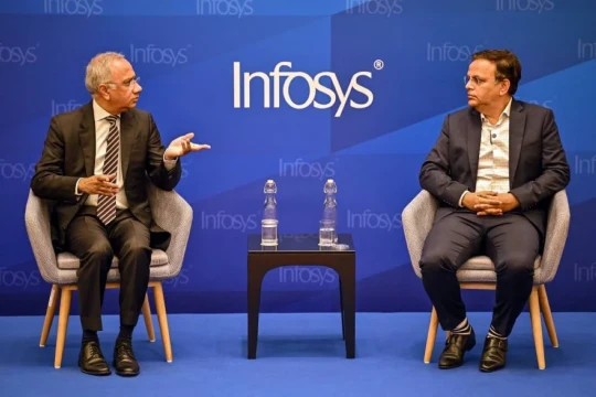 India's IT giant Infosys hikes revenue forecast as demand slowly recovers